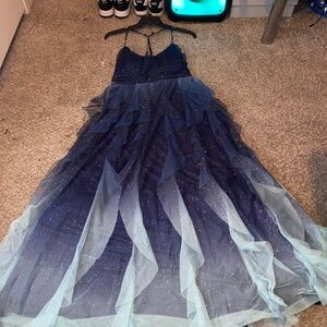 Wore once six m ago still in plastic, it has a corset backing to fit all boobs